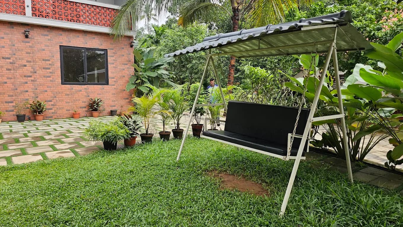 Garden swing seat under awning